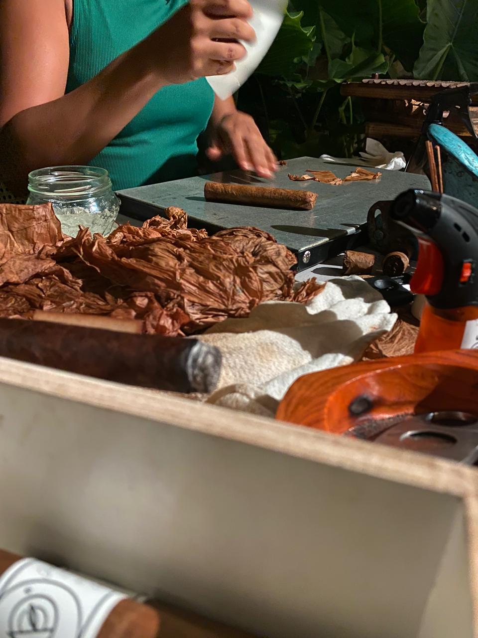 Master cigar roller performing live tobacco craftsmanship at wedding